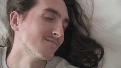 Young handsome man wake up Stock Footage 197823306