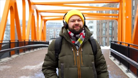 Young handsome man is walking down the street Video stock 103866947