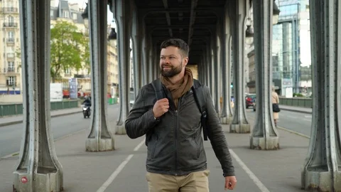 Young handsome man is walking down the street in Paris Stock-Footage 108185881