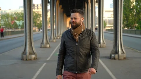 Young handsome man is walking down the street in Paris Stock Footage 108637533