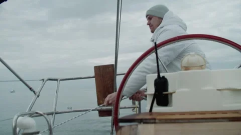 Young handsome man went out to sea on a yacht Stock Footage 316691640