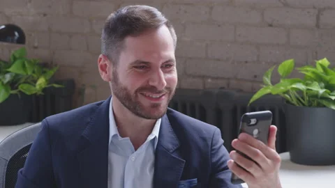A young, handsome middle-eastern man is making a video call to relatives and Stock Footage 136542795