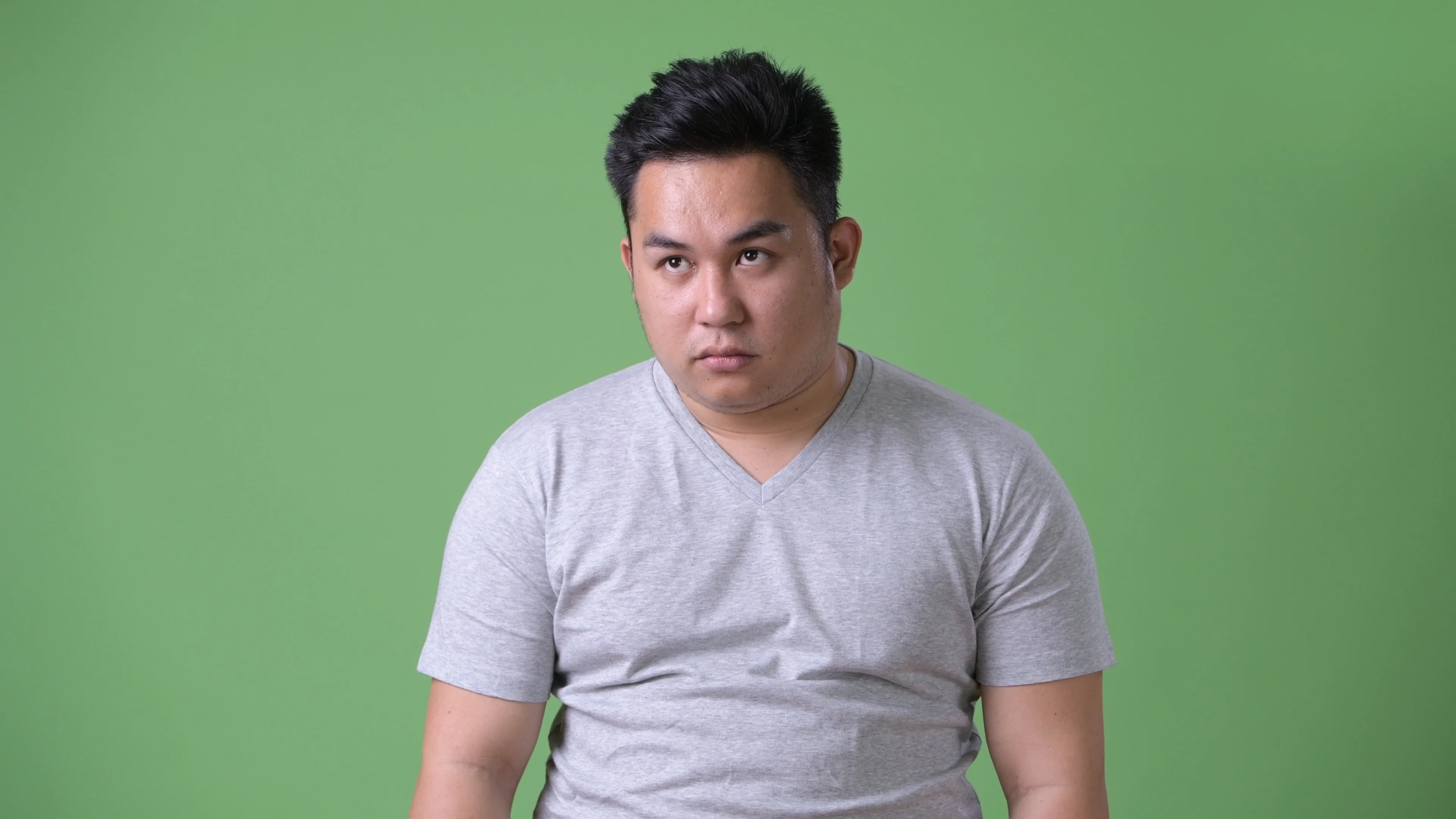 Video Young Handsome Overweight Asian Man Against Green
