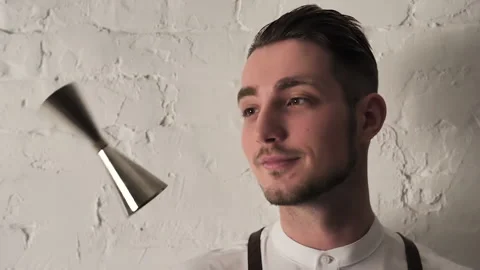 Young Handsome Professional Bartender juggling with Shaker Slow Motion Stock Footage 132383100