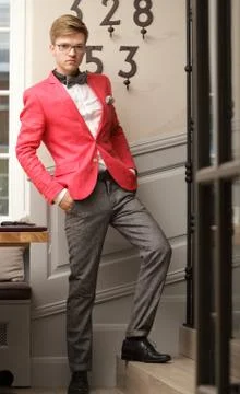 Young handsome stylish man posing indoor Stock Photos