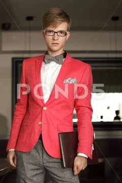 Young handsome stylish man posing indoor Stock Photos