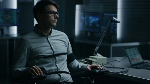 Young Handsome Suspect During Interrogation Undergoes Lie Detector / Polygraph 動画素材 94568704