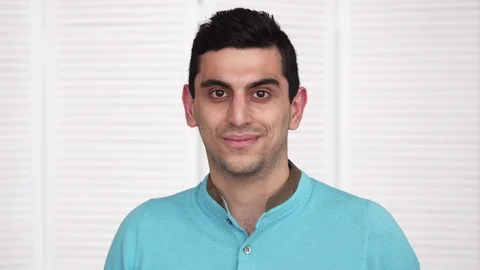 Young happy arabic man looking at camera Stock Footage 86382647