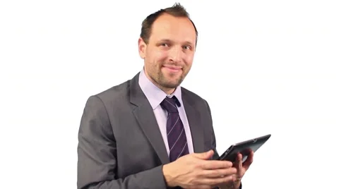 Young happy businessman with tablet computer, isolated on white HD Stock Footage 10747888