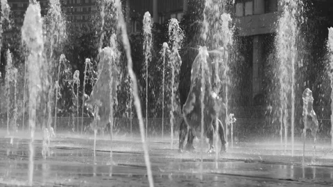 Young happy couple dancing in the fountain Stock Footage