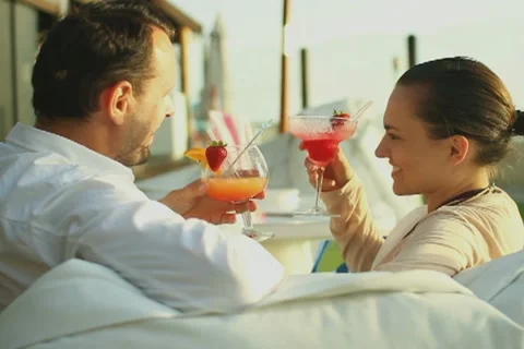 Young happy couple drinking exotic cocktails  NTSC Stock Footage 10901710