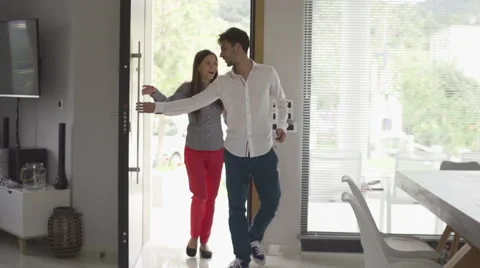 Young, happy couple entering new home, slow motion 120fps Stock Footage