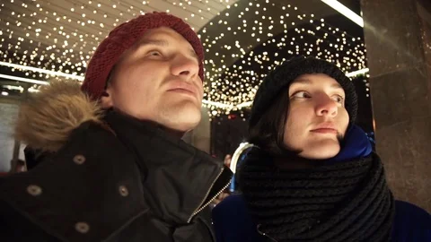 Young happy couple spends time together on busy urban street in evening Stock Footage 83918260