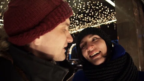 Young happy couple spends time together on busy urban street in evening Stock-Footage 83919077