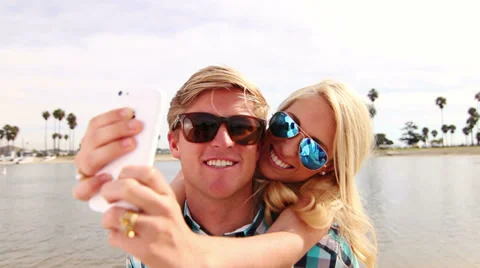 Young Happy Couple Taking Selfie (Self Portrait) Outside At Beach Stock Footage
