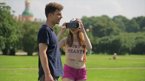 Young happy couple with virtual reality glasses. They getting VR experience  Stock Footage 66421146