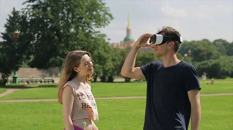 Young happy couple with virtual reality glasses. They getting VR experience  Stock Footage 66421213