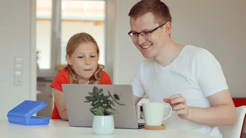 Young happy father checking emails with his cute little daughter Video stock 156012265