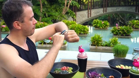 Young happy fitted man checking his fitness and sports activity on smart watch Video stock 197662001