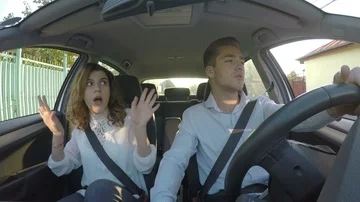 Young happy fun couple singing and dancing in the car Stock Footage 85597972
