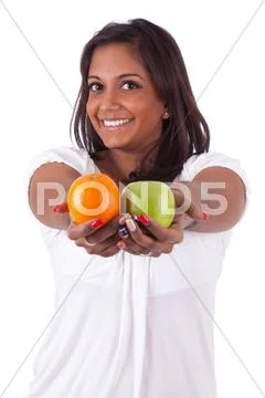 Young happy indian woman holding fruits Stock Photos
