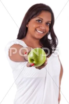 Young happy indian woman holding an apple Stock Photos