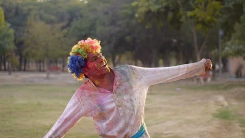 Young happy man having fun during joyful Holi celebration - Indian festival a... Stock Footage 124521442
