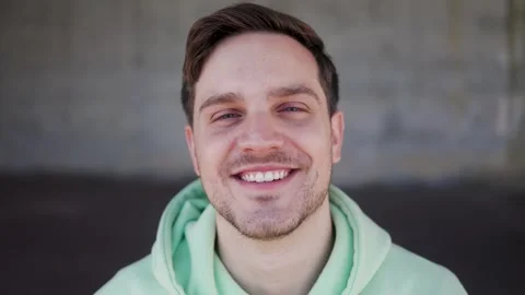 Young happy man smiling on camera outdoor, Face portrait Stock Footage 309043188