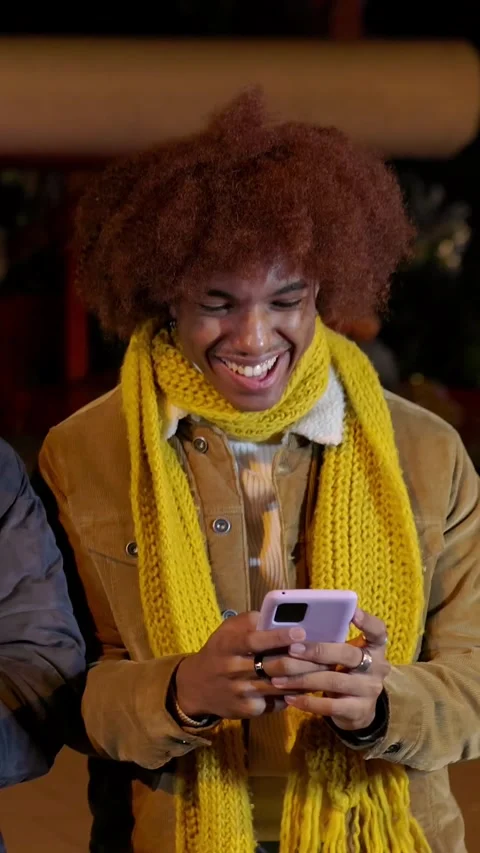 Young happy man using mobile phone outside on winter Stock Footage 286062155