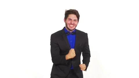Young happy man on white background celebrating his achievement Video stock 71440174