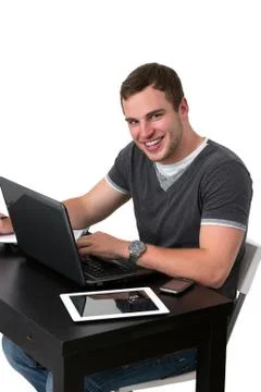 Young happy man working on pc Foto stock