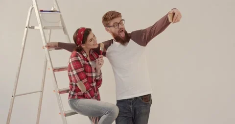 Young happy married couple making joint family photo on the background of Stock Footage 144628857