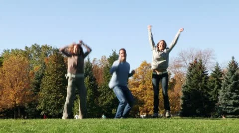 Young happy people jumping Stock Footage