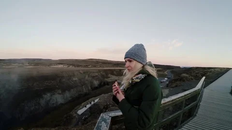 Young happy woman standing on the bridge and enjoying the beautiful landscape Stock Footage