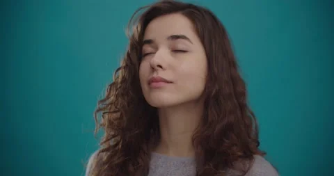 Young happy woman is taking off protective medical mask, smiling and breathe Stock Footage
