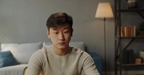 Young hardworking asian manager working from home on laptop, typing on keyboard Stock Footage 128009514