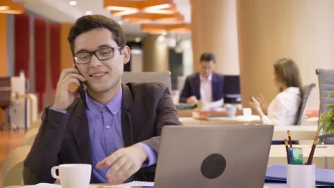 Young hardworking woman works on laptop very focused sitting in co working Stock Footage