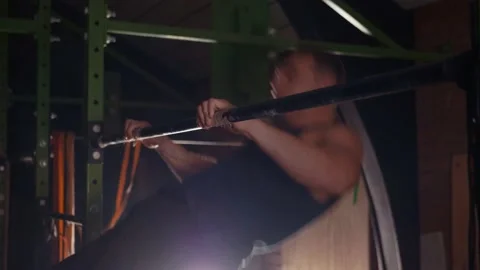 Young healthy guy doing bar muscle-up exercise Stock Footage 131221873