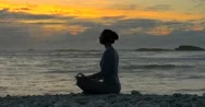 Young Healthy Woman Practising Yoga Meditation At Sunrise / Sunset Stock Footage