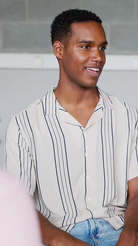Young high school student boy discussing with classmates Stock Footage 312199393
