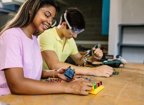Young high school students learning together at stem robotics class Stock Photos