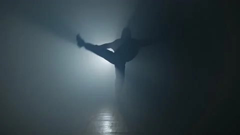 Young hip-hop dancer performing on stage with smoke. Girl in street wear dancing 스톡 동영상 135083507