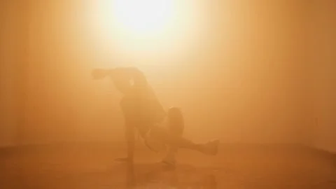 Young hipster b-boy doing breakdancing practice in dance studio Stock Footage 132070356