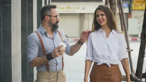 Young hipster couple talking together on street in urban city Stock Footage 155221878