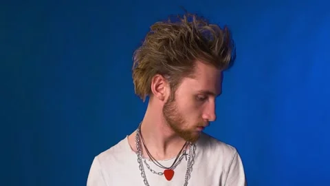 Young hipster guy with beard and chains posing for the camera 스톡 동영상 135249664