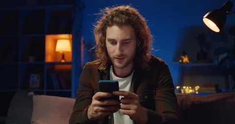 Young hipster guy making yes gesture and smiling while having good news Video stock 128883381