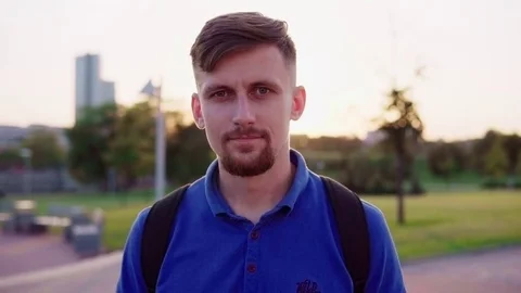 Young hipster man looking at camera Stock Footage 78936567