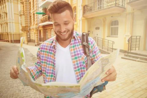 Young hipster man with map Stock Photos