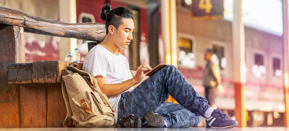 Young hipster man relax using digital tablet online planning tourist travel h Stock Photos