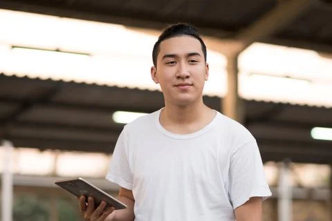 Young hipster man relax using digital tablet online planning tourist travel h Stock Photos